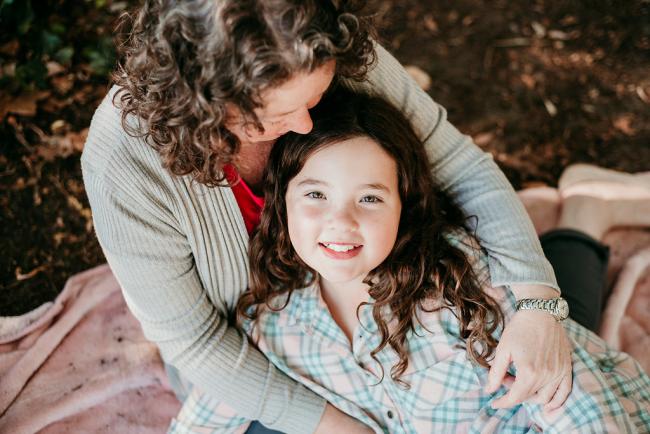 20180520-DSC_5288 Daughter laying in her mothers lap during a family photography session at Hyde Park, Perth