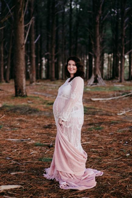 20180614-DSC_9806 Pregnant woman standing with a blanket around her feet during a maternity photography session at The Pines Wanneroo in Perth