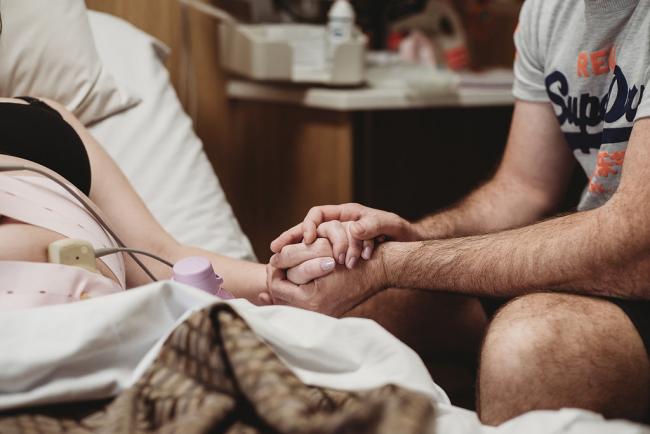 Couple holding hands during Perth birth photography session