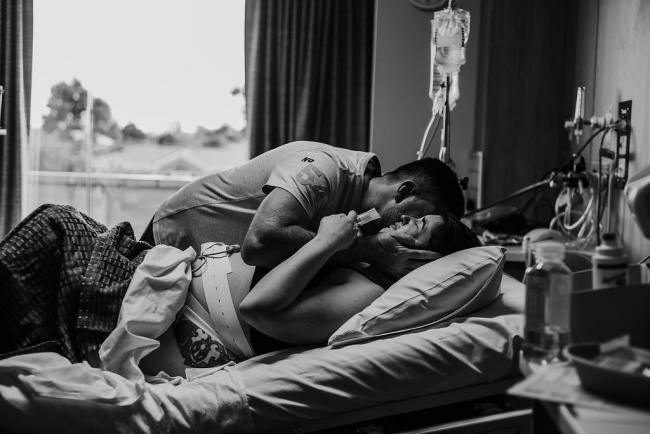 Black and white image of mother in labour during a Perth birth photography session