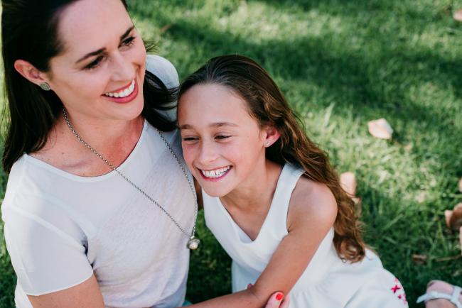 Mother and daughter laugh during family photography Perth session
