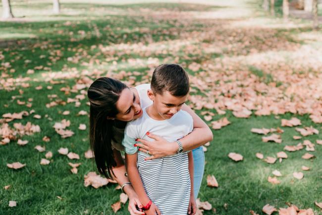 Mother hugging son from behind during family photography Perth session
