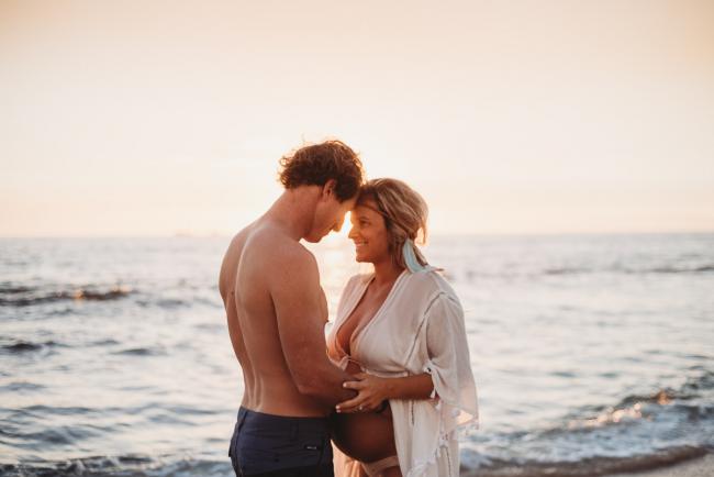 20180505-20180505-DSC_2772 Couple touching forehads by the water during maternity photography Perth session at Burns Beach