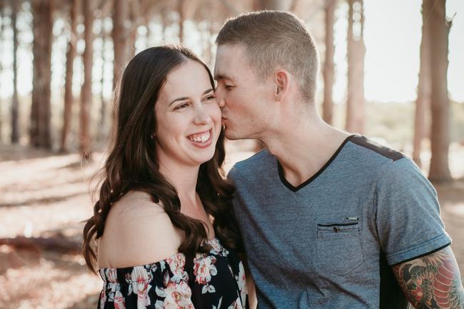 20180518-20180518-DSC_4159 Husband kissing his wife during family photography Perth session at The Pines Wanneroo