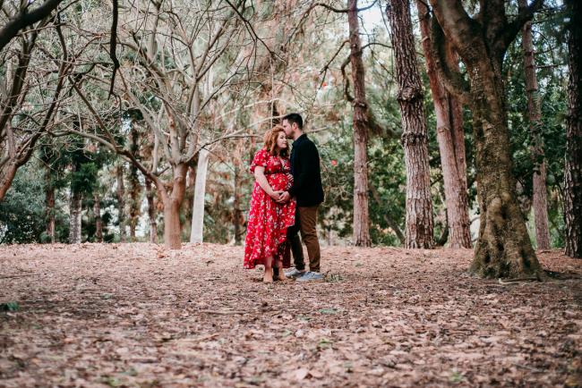20180609-20180609-DSC_7283 Pregnant couple standing in between trees during maternity photography Perth session at John Oldham Park