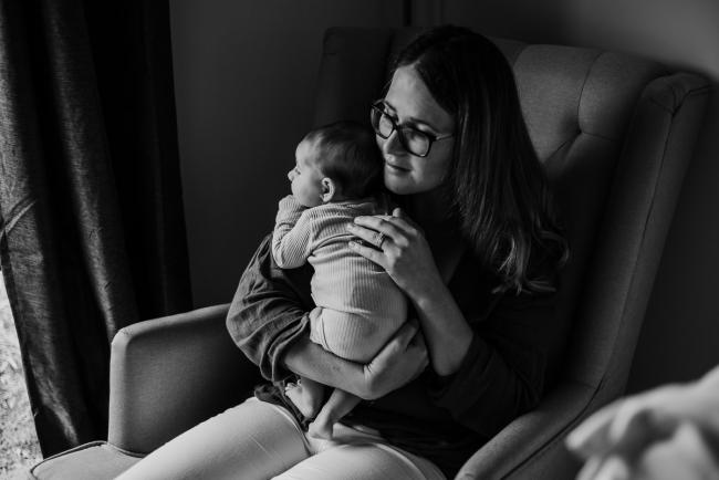 20180610-20180610-DSC_8402 black and white image of woman holding her new baby during lifestyle newborn photography Perth session