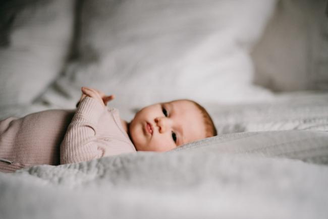 20180610-20180610-DSC_8903 baby laying on the bed during lifestyle newborn photography Perth session