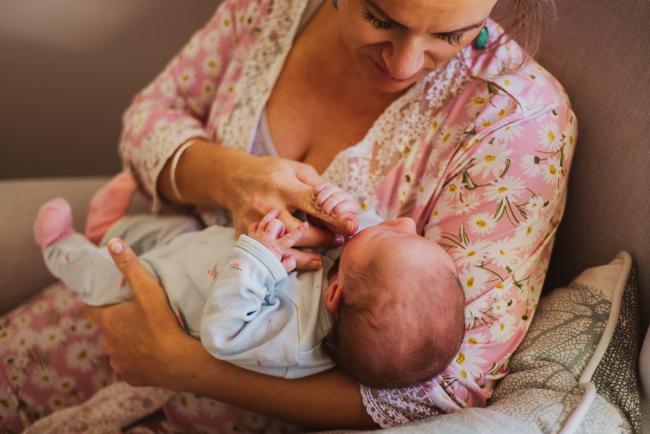 20180615-DSC_0398 mother holding new baby during lifestyle newborn photography Perth session