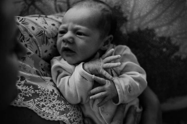 20180615-DSC_0409 black and white image of baby looking up at mother during lifestyle newborn photography Perth session