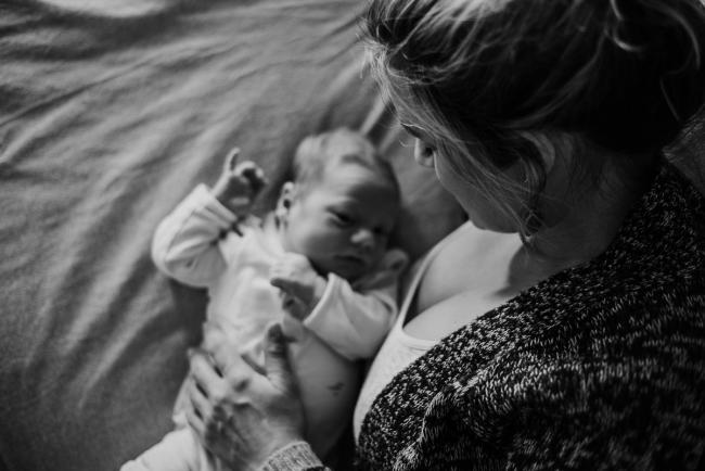 20180615-DSC_0565 black and white image of mother looking down at her new baby during lifestyle newborn photography Perth session