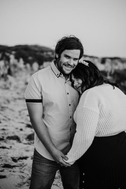 20180616-20180616-DSC_1650 black and white image of woman leaning with her head on partners chest during maternity photography Perth session at Burns Beach