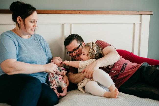 20180720-DSC_8917 Family sitting on the bed with their new baby during lifestyle newborn photography Perth session