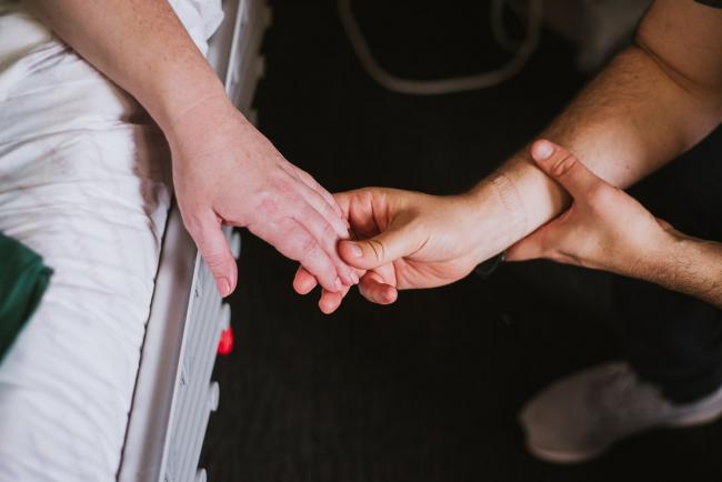 Couple holding hands during Perth birth photography session