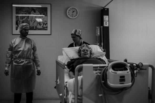 black and white image of pregnant mother about to go into surgery during Perth birth photography session