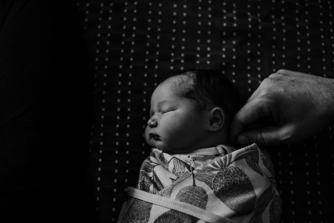20180809-DSC_6601 black and white image of new baby laying on bed during Fresh 48 photography Perth session