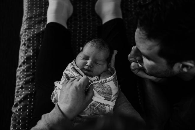 20180809-DSC_6622 black and white image of new baby laying on mum's legs during Fresh 48 photography Perth session