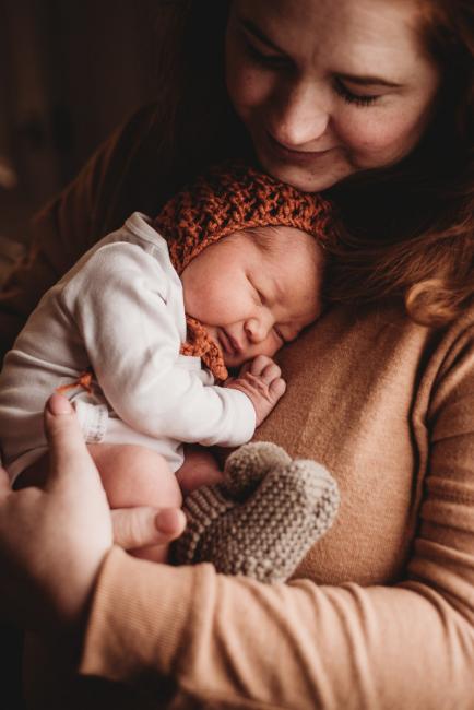 Mother holding her new baby to her chest during Fresh 48 Photography Perth session