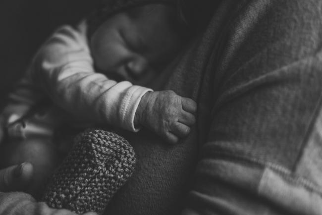 20180809-DSC_7132 black and white image of baby's hands on mothers chest during Fresh 48 photography Perth session