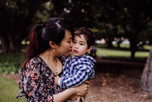 20180908-DSC_4034 Mother holding son and nuzzling her face into his cheek during extended family photography Perth session at Hyde Park