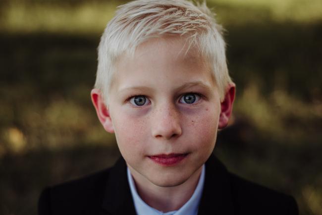 20180909-DSC_5177 Close up of boys face during golden hour family photography Perth session at Perry's Paddock