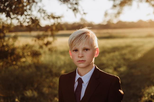 20180909-DSC_5457 Boy looking at camera during golden hour family photography Perth session at Perry's Paddock