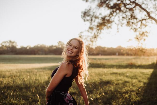 20180909-DSC_5675 Girl dances in front of the camera during golden hour family photography Perth session at Perry's Paddock