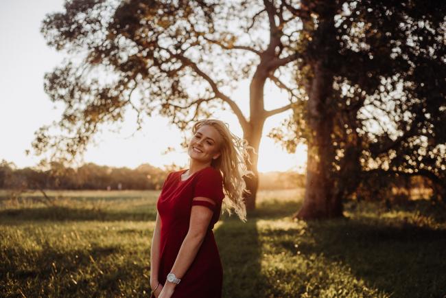 20180909-DSC_5700 Girl in red dress in front of the camera during golden hour family photography Perth session at Perry's Paddock