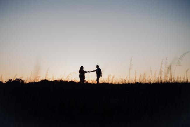 Silhouette of a couple holding hands during a couples photography session at Perry's Paddock, Perth