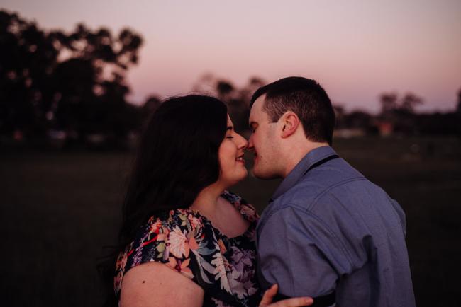 Couple almost kissing during a couples photography session at Perry's Paddock, Perth