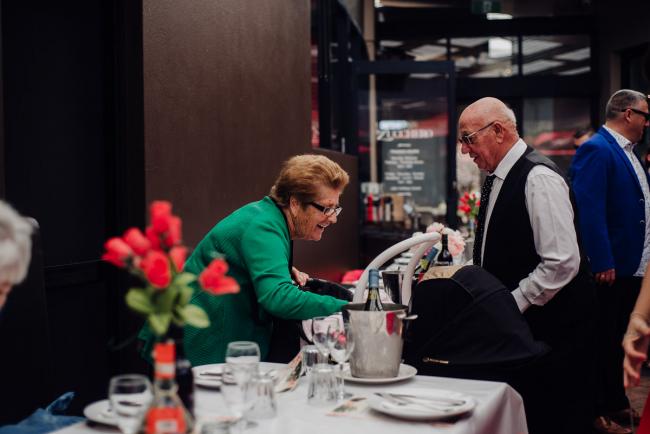 20180930-DSC_0100 Nonna reaching in the pram to see the baby during events photography Perth session