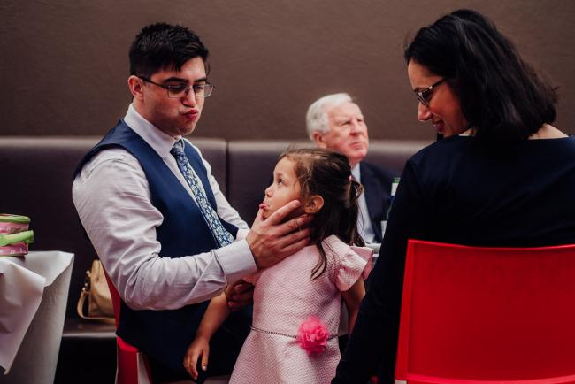 20180930-DSC_0288 Father pulling a face at daughter as he squeezes her cheeks during events photography Perth session
