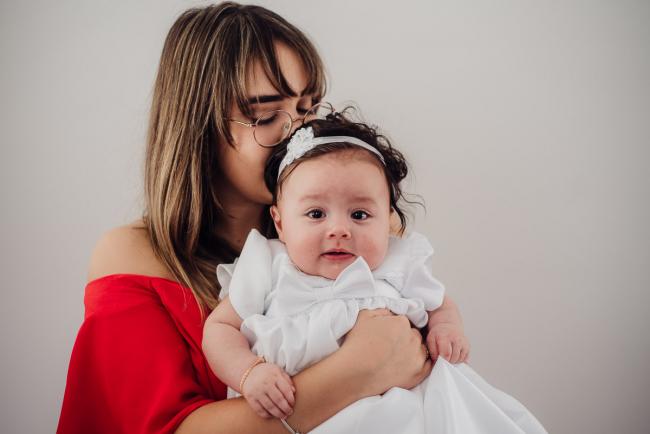 20180930-DSC_9387 Woman hugging baby who is being christened during events photography Perth session