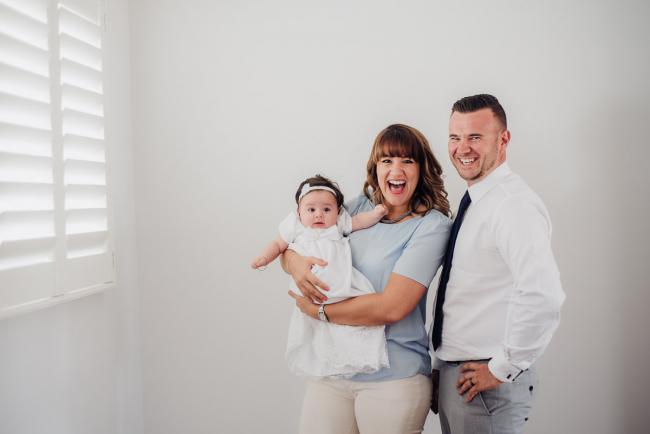 20180930-DSC_9402 Couple holding christened baby and smiling during events photography Perth session