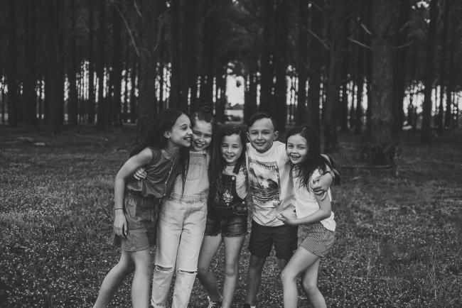 20181005-DSC_0410 Black and white image of cousins with their arms around each other during Perth family photography session at The Pines Wanneroo