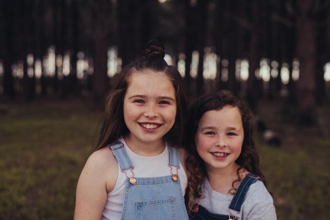 20181005-DSC_0415 Sisters smiling during Perth family photography session at The Pines Wanneroo