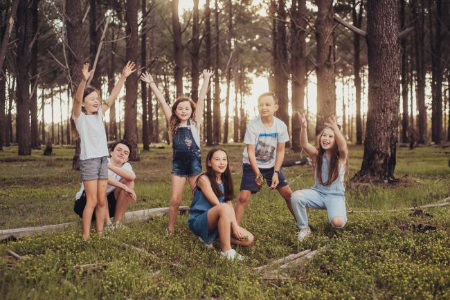 20181005-DSC_0665 Cousins throwing flowers in the air during Perth family photography session at The Pines Wanneroo