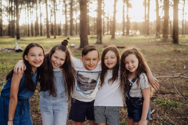 20181005-DSC_0877 Cousins with arms around each other during Perth family photography session at The Pines Wanneroo
