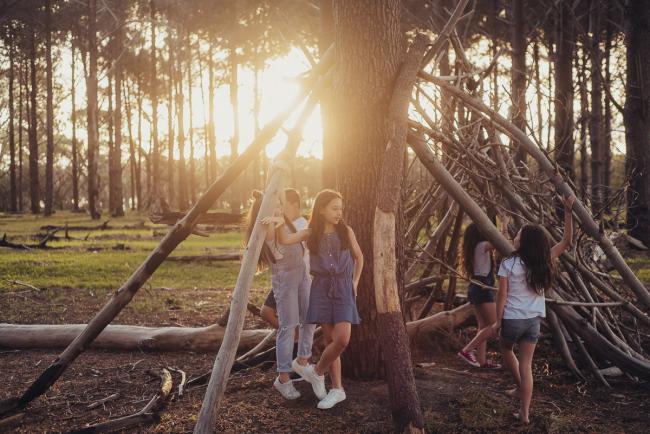 20181005-DSC_1034 Cousins in a stick teepee during Perth family photography session at The Pines Wanneroo