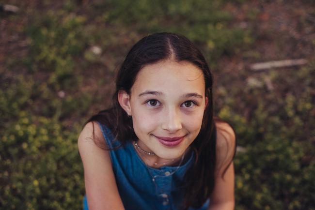 20181005-DSC_1357 Girl looking up at the camera during Perth family photography session at The Pines Wanneroo