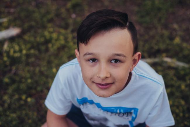20181005-DSC_1401 Boy smiling at the camera during Perth family photography session at The Pines Wanneroo