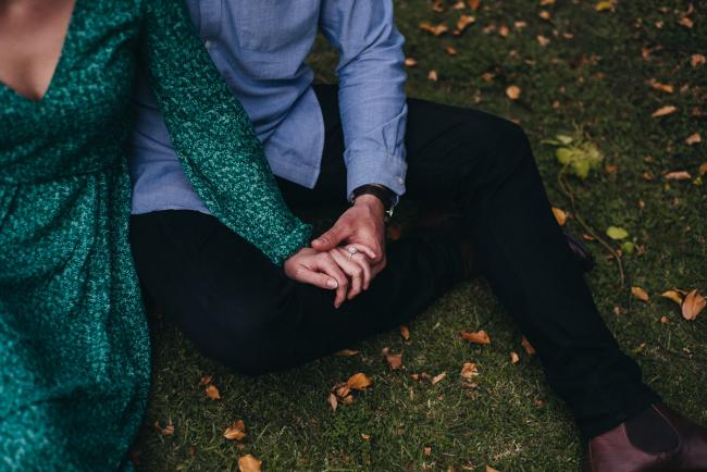 Couple holding hands during a Perth family session at Hyde Park