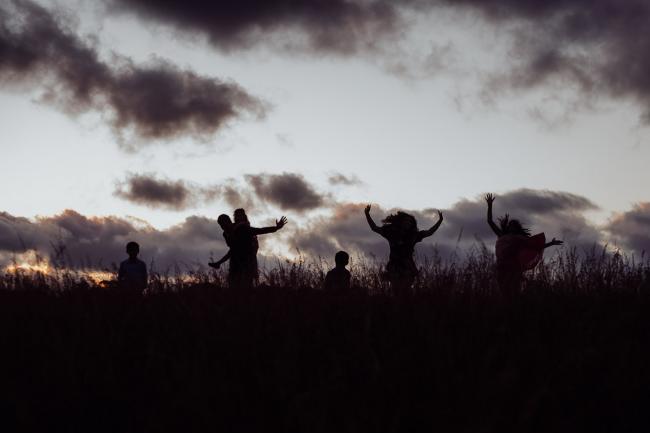 Silhouette image of a family during a golden hour family photography session at Perry's Paddock in Perth