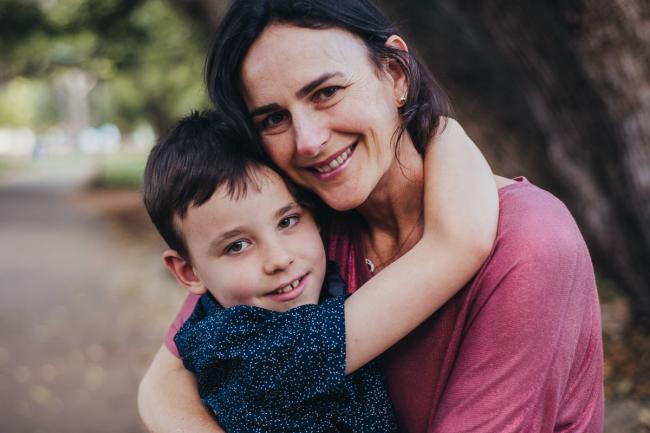 Mother and son hugging during a Family photography session in Hyde Park, Perth
