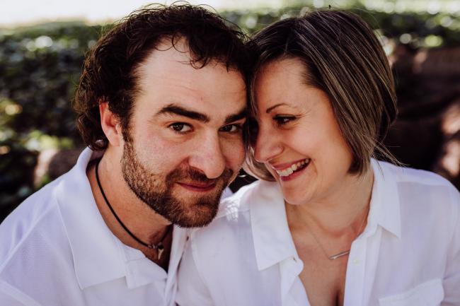 Wife smiling at her husband during a mini session with Perth family photographer at Hyde Park