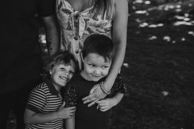 20181104-DSC_6896 Black and white image of mother holding onto her two sons during a mini session with Perth family photographer at Hyde Park