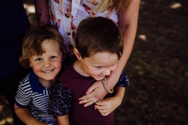20181104-DSC_6898 Two boys being hugged by their mother during a mini session with Perth family photographer at Hyde Park