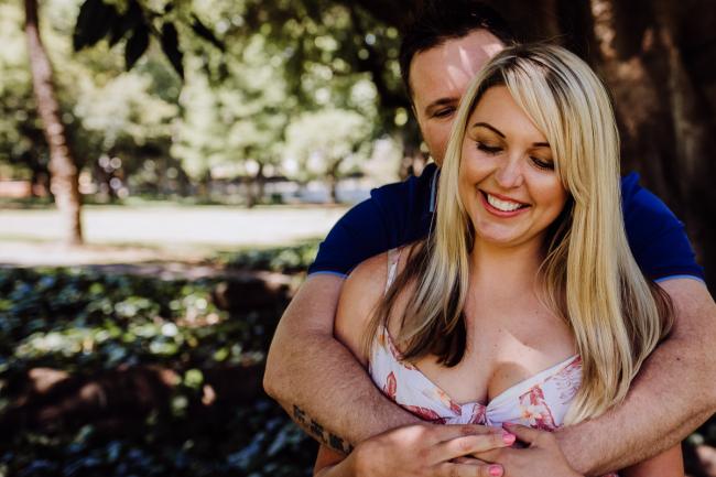 20181104-DSC_7277 Man hugging his wife from behind during a mini session with Perth family photographer at Hyde Park