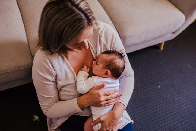 20181111-DSC_8398-1 top down shot of a mother holding her new baby in a lifestyle family photography session Perth