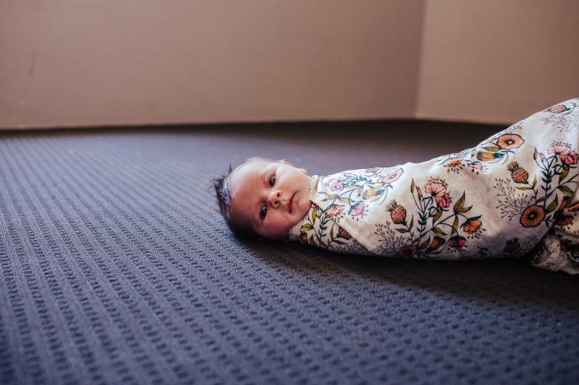 20181111-DSC_8671-2 New baby wrapped in a floral blanket on the floor in a lifestyle family photography session Perth