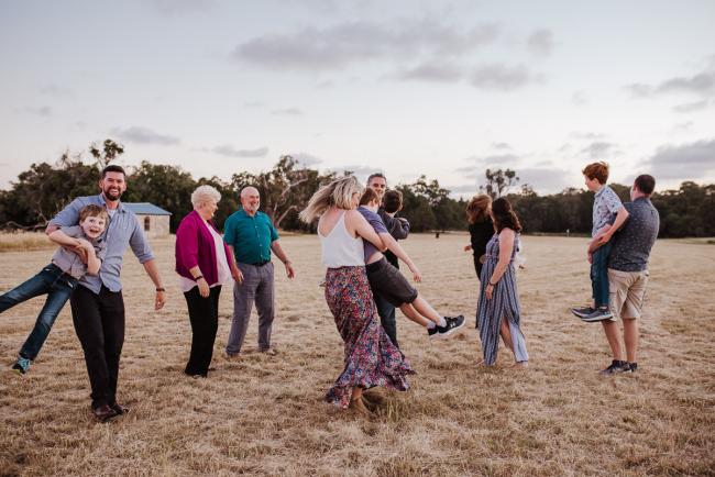Extended family all spinning together during golden hour family photography session at Perry's Paddock Perth